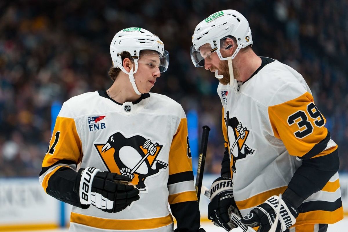 Jan 25, 2026; Vancouver, British Columbia, CAN; Pittsburgh Penguins forward Ben Kindel (81) talks with forward Anthony Mantha (39) during a stop in play against the Vancouver Canucks in the third period at Rogers Arena. Mandatory Credit: Bob Frid-Imagn Images