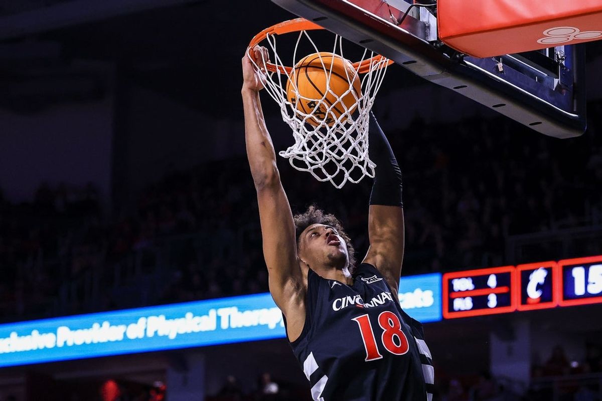Jan 28, 2026; Cincinnati, Ohio, USA; Cincinnati Bearcats forward Baba Miller (18) dunks on the Baylor Bears in the first half at Fifth Third Arena. Mandatory Credit: Katie Stratman-Imagn Images
