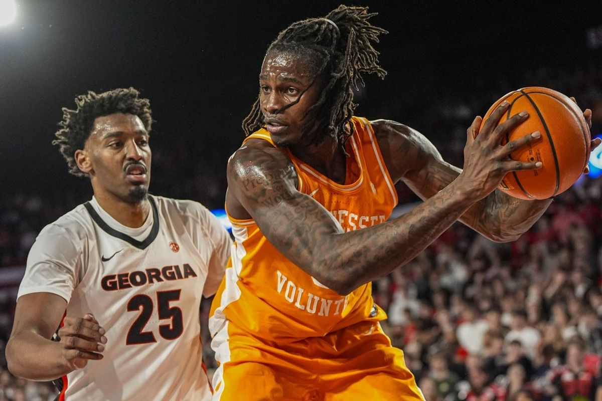 Jan 28, 2026; Athens, Georgia, USA; Tennessee Volunteers center Felix Okpara (34) controls the ball behind Georgia Bulldogs forward Justin Abson (25) during the first half at Stegeman Coliseum. Mandatory Credit: Dale Zanine-Imagn Images