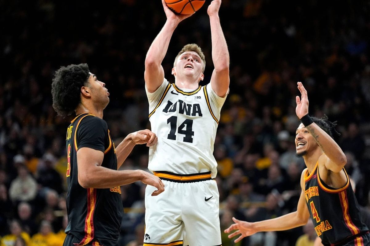 Iowa guard Bennett Stirtz (14) shoots the basketball against the USC Trojans Jan. 28, 2026 at Carver-Hawkeye Arena in Iowa City, Iowa.