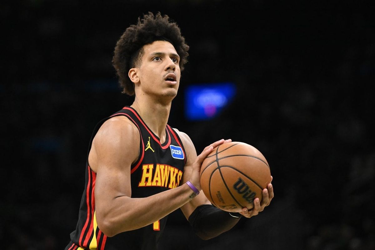 Jan 28, 2026; Boston, Massachusetts, USA; Atlanta Hawks forward Jalen Johnson (1) attempts a free-throw against the Boston Celtics during the first half at the TD Garden. Mandatory Credit: Brian Fluharty-Imagn Images