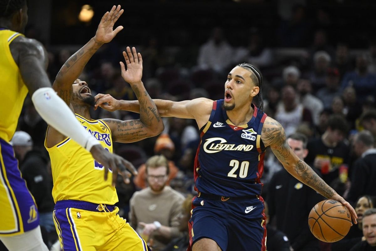 Jan 28, 2026; Cleveland, Ohio, USA; Los Angeles Lakers guard Marcus Smart (36) defends Cleveland Cavaliers guard Jaylon Tyson (20) in the third quarter at Rocket Arena. Mandatory Credit: David Richard-Imagn Images