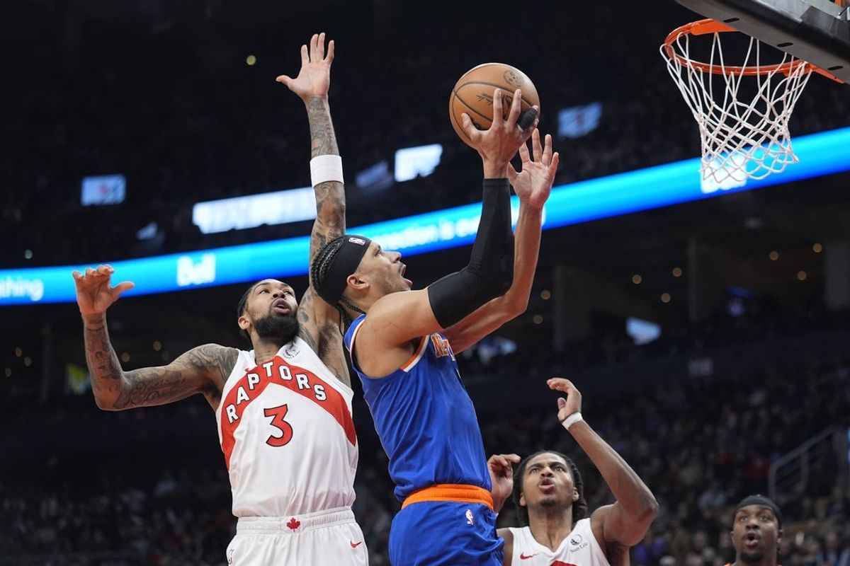 Jan 28, 2026; Toronto, Ontario, CAN; New York Knicks forward Josh Hart (3) goes up to make a basket against Toronto Raptors forward Brandon Ingram (3) during the first half at Scotiabank Arena. Mandatory Credit: John E. Sokolowski-Imagn Images