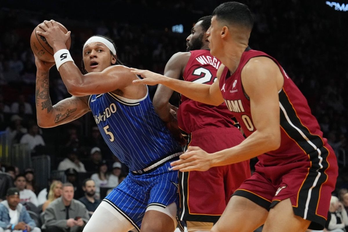 Jan 28, 2026; Miami, Florida, USA;  Orlando Magic forward Paolo Banchero (5) takes a shot over Orlando Magic guard Anthony Black (0) during the first half at Kaseya Center. Mandatory Credit: Jim Rassol-Imagn Images
