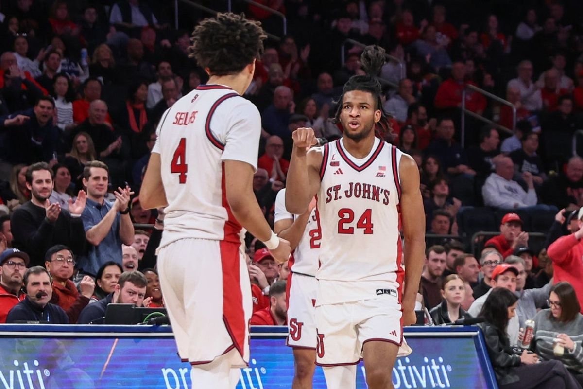 Jan 28, 2026; New York, New York, USA;  St. John's Red Storm forward Zuby Ejiofor (24) celebrates with guard Oziyah Sellers (4) in the second half against the Butler Bulldogs at Madison Square Garden. Mandatory Credit: Wendell Cruz-Imagn Images