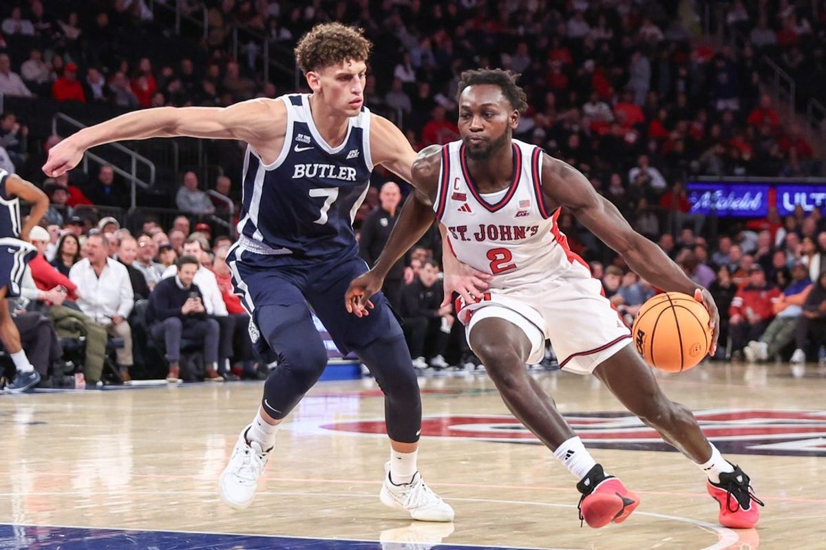 Jan 28, 2026; New York, New York, USA;  St. John's Red Storm forward Sadiku Ibine Ayo (2) drives past Butler Bulldogs guard Jamie Kaiser Jr. (7) in the second half at Madison Square Garden. Mandatory Credit: Wendell Cruz-Imagn Images