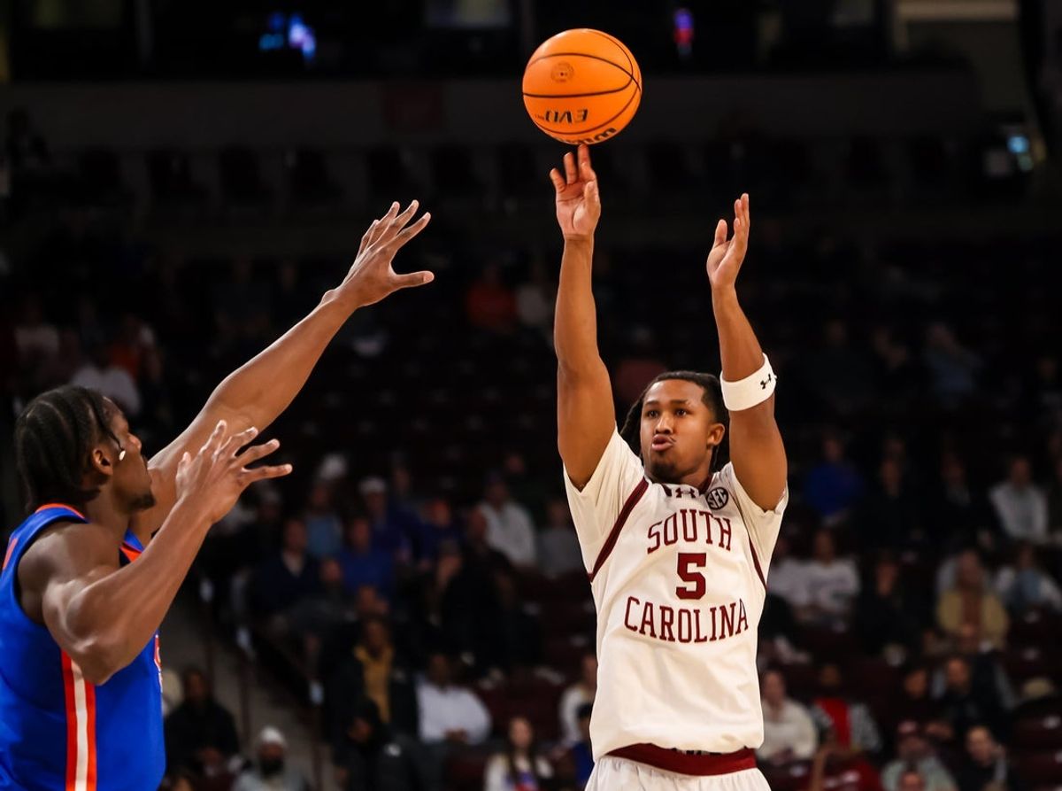Jan 28, 2026; Columbia, South Carolina, USA; South Carolina Gamecocks guard Meechie Johnson (5) attempts a three point basket against the Florida Gators in the first half at Colonial Life Arena. Mandatory Credit: Jeff Blake-Imagn Images