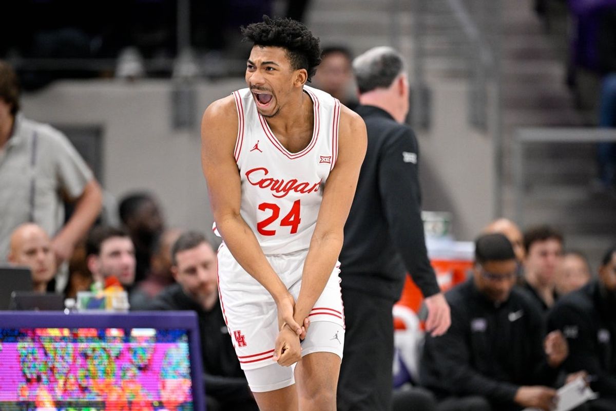 Jan 28, 2026; Fort Worth, Texas, USA; Houston Cougars forward Chase McCarty (24) yells to the bench as he grabs his wrist during the first half against the TCU Horned Frogs at Ed and Rae Schollmaier Arena. Mandatory Credit: Jerome Miron-Imagn Images