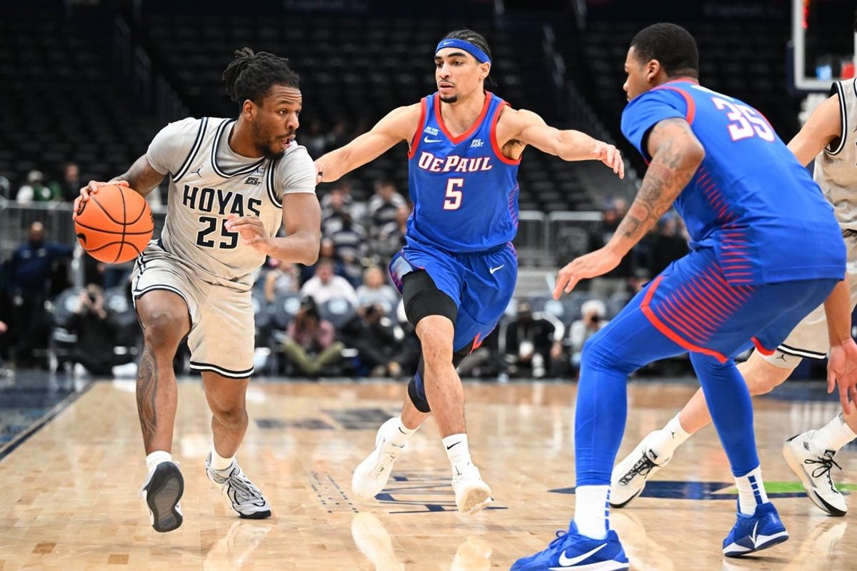 Jan 28, 2026; Washington, District of Columbia, USA; Georgetown Hoyas guard Jeremiah Williams (25) dribbles as DePaul Blue Demons guard RJ Smith (5) defends during the second half at Capital One Arena. Mandatory Credit: Brad Mills-Imagn Images