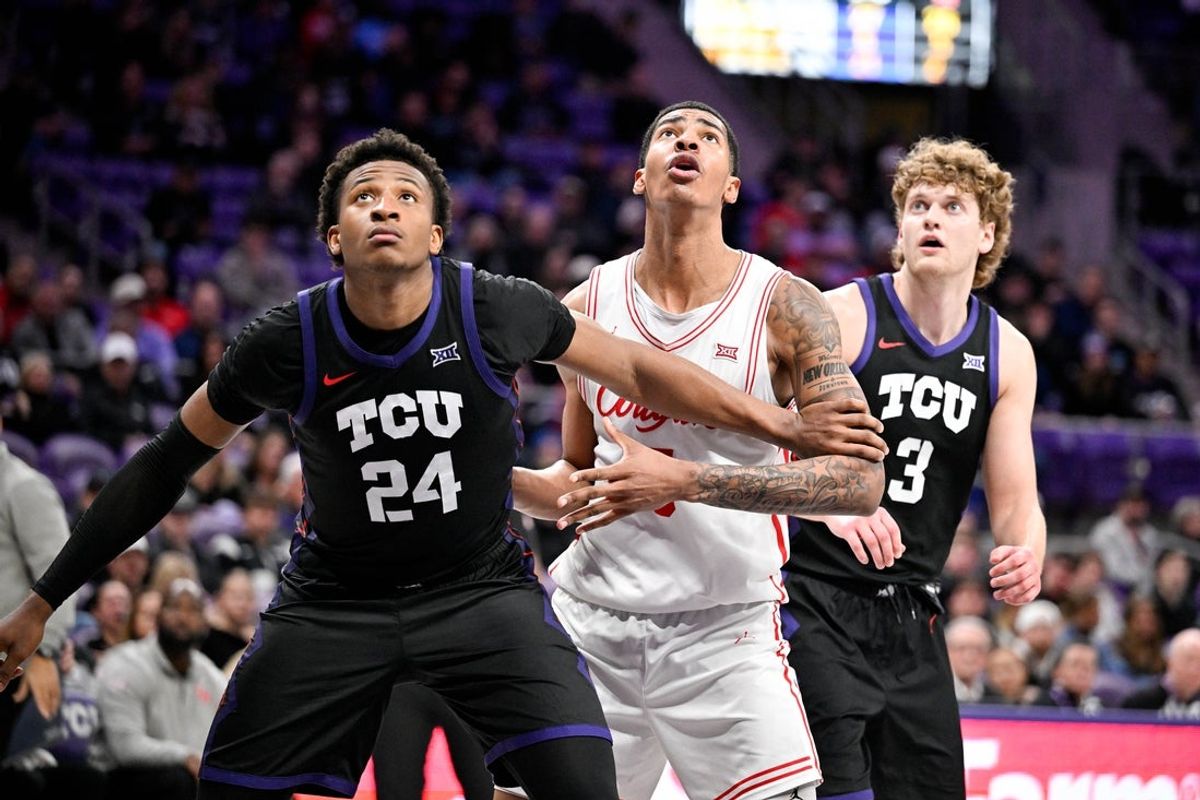 Jan 28, 2026; Fort Worth, Texas, USA; TCU Horned Frogs forward Xavier Edmonds (24) and Houston Cougars forward Chris Cenac Jr. (5) looks for the ball during the second half at Ed and Rae Schollmaier Arena. Mandatory Credit: Jerome Miron-Imagn Images