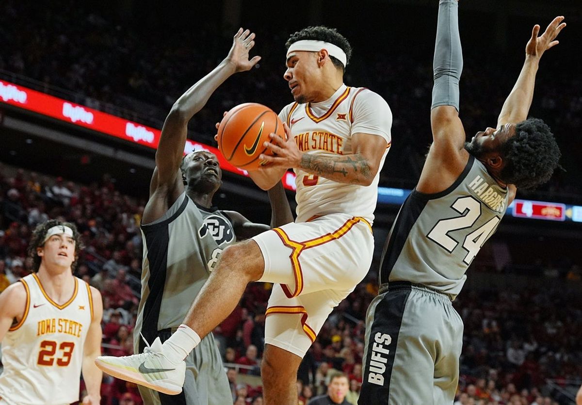 Iowa State Cyclones guard Tamin Lipsey (3) passes the ball between Colorado Buffaloes guard Barrington Hargress (24) and forward Bangot Dak (8) during the first half in the big-12 men’s basketball on Jan. 29, 2026, at Hilton Coliseum in Ames, Iowa.