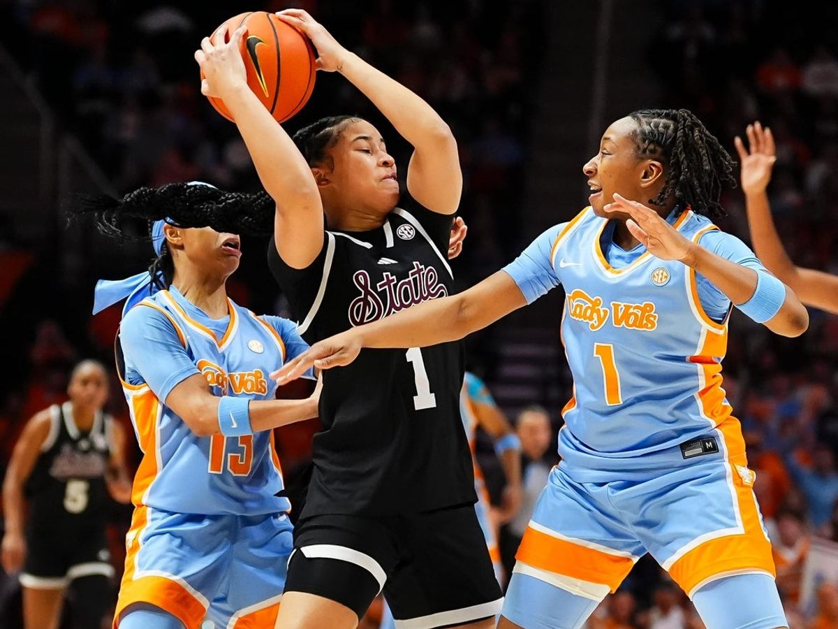 Mississippi State guard Saniyah King (1) is defended by Tennessee guard Mia Pauldo (13) and Tennessee guard Nya Robertson (1) during a women's college basketball game between the Lady Vols and Mississippi State held at Thompson-Boling Arena at Food City Center in Knoxville, Tenn., on Jan. 29, 2026.