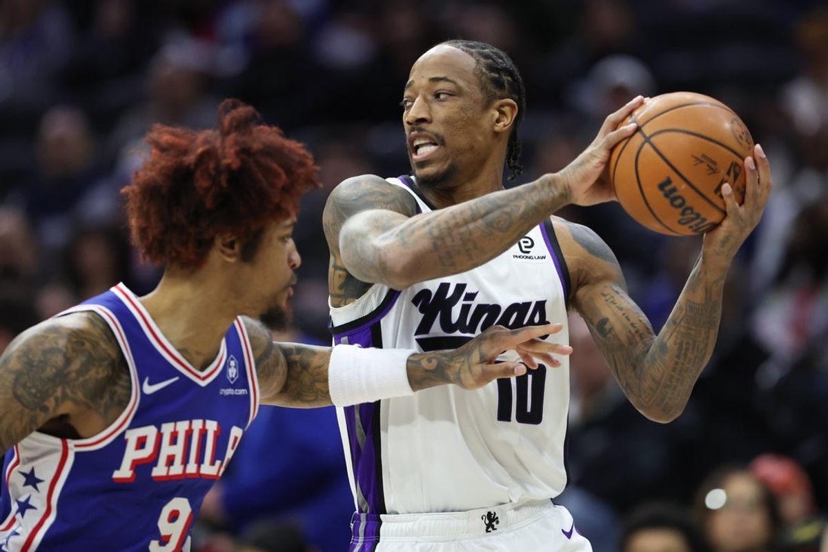Jan 29, 2026; Philadelphia, Pennsylvania, USA; Sacramento Kings guard DeMar DeRozan (10) controls the ball against Philadelphia 76ers guard Kelly Oubre Jr. (9) during the first quarter at Xfinity Mobile Arena. Mandatory Credit: Bill Streicher-Imagn Images