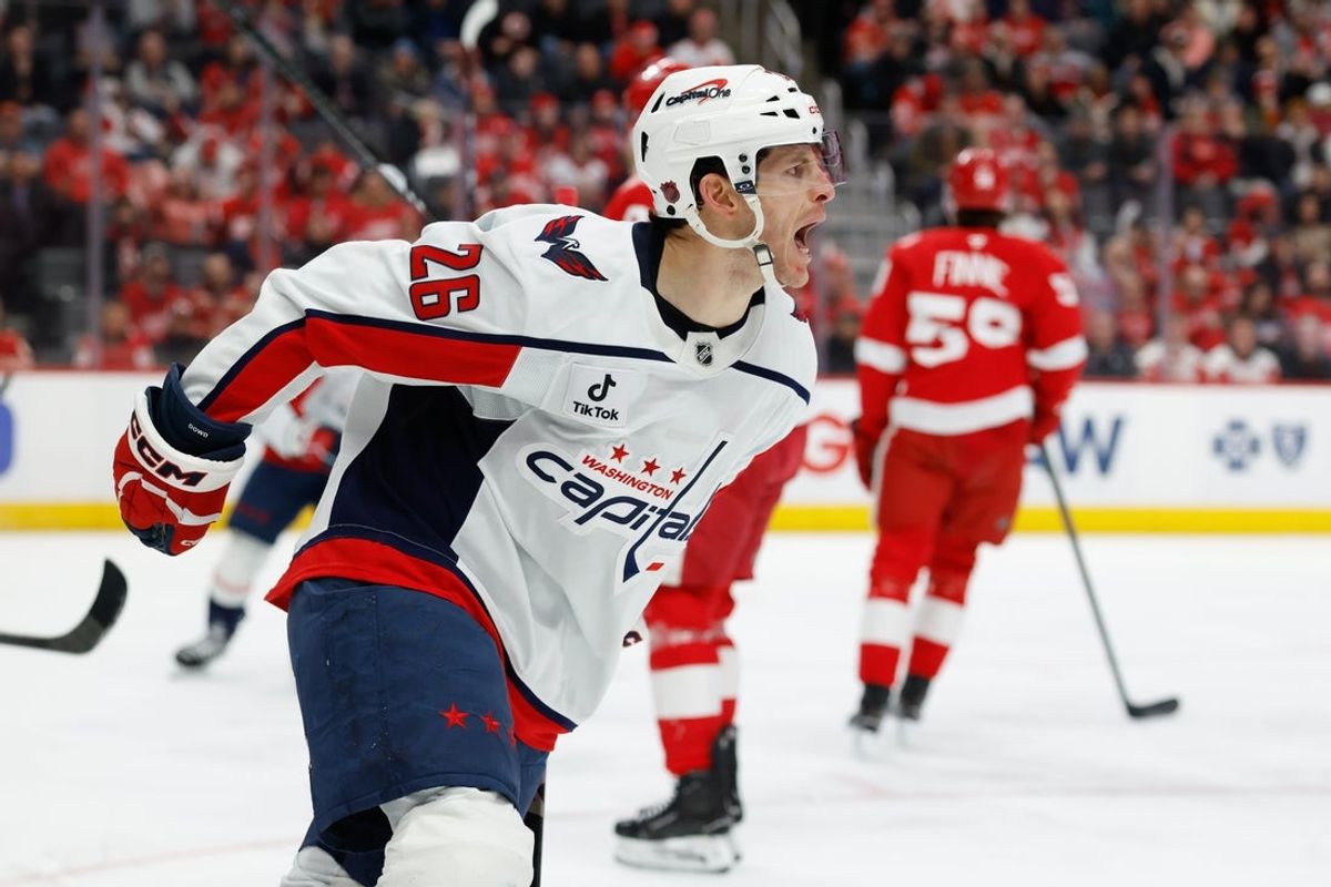 Jan 29, 2026; Detroit, Michigan, USA;  Washington Capitals center Nic Dowd (26) celebrates after scoring in the first period against the Detroit Red Wings at Little Caesars Arena. Mandatory Credit: Rick Osentoski-Imagn Images