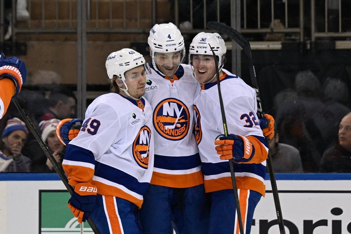 Jan 29, 2026; New York, New York, USA;  New York Islanders right wing Max Shabanov (49) and New York Islanders center Kyle MacLean (32) celebrates the goal by New York Islanders defenseman Carson Soucy (4) against the New York Rangers during the second period at Madison Square Garden. Mandatory Credit: Dennis Schneidler-Imagn Images