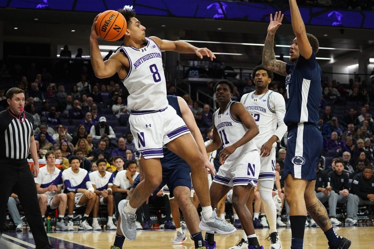 Jan 29, 2026; Evanston, Illinois, USA; Northwestern Wildcats forward Tre Singleton (8) saves the from going out of bounds against the Penn State Nittany Lions during the first half at Welsh-Ryan Arena. Mandatory Credit: David Banks-Imagn Images