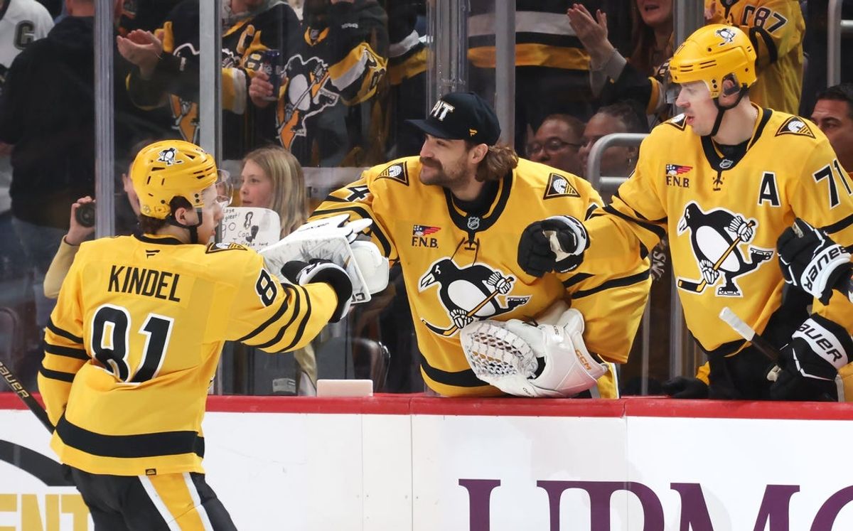 Jan 29, 2026; Pittsburgh, Pennsylvania, USA;  Pittsburgh Penguins center Ben Kindel (81) celebrates his goal with goaltender Stuart Skinner (74) and center Evgeni Malkin (71) at the bench against the Chicago Blackhawksduring the second period at PPG Paints Arena. Mandatory Credit: Charles LeClaire-Imagn Images