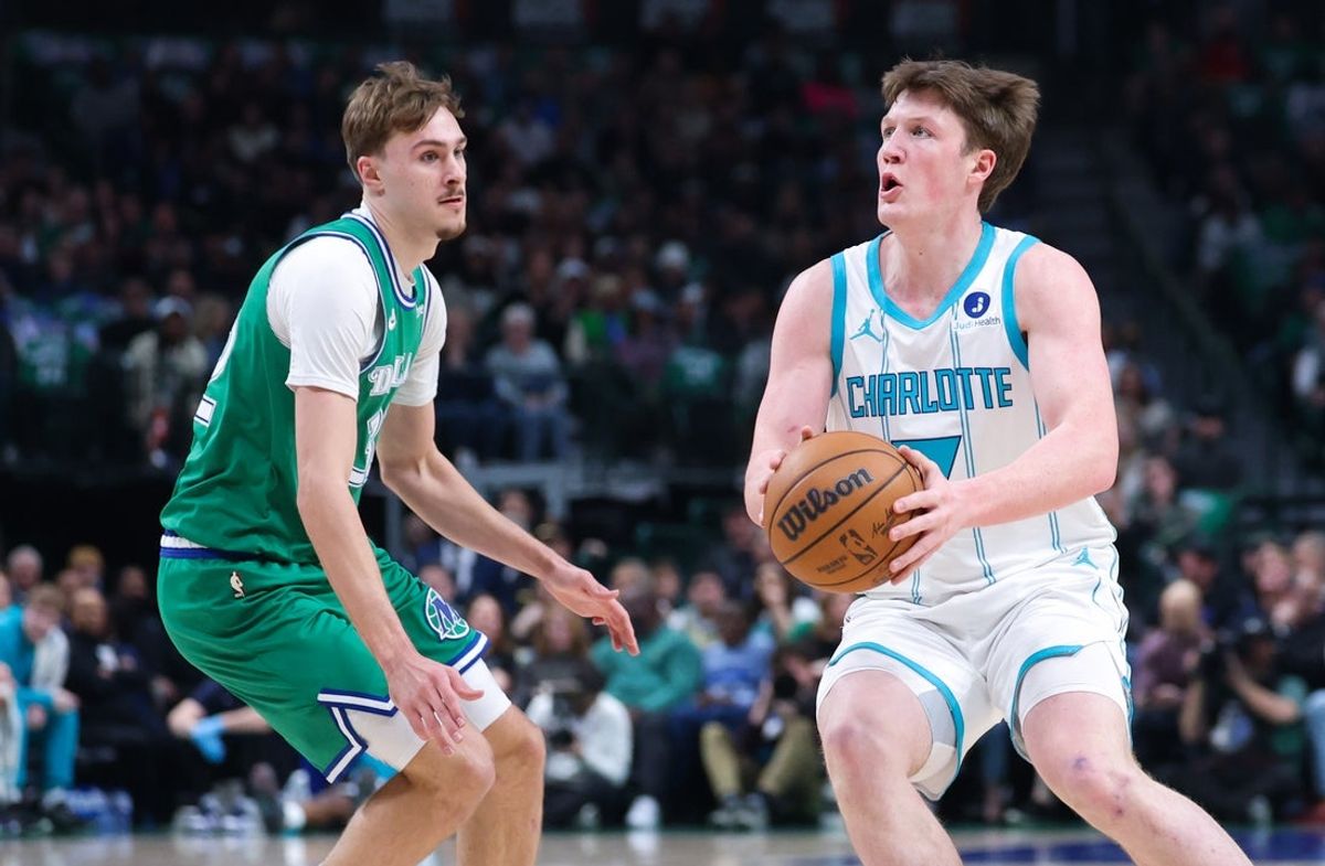 Jan 29, 2026; Dallas, Texas, USA;  Charlotte Hornets guard Kon Knueppel (7) shoots as Dallas Mavericks forward Cooper Flagg (32) defends during the first quarter at American Airlines Center. Mandatory Credit: Kevin Jairaj-Imagn Images