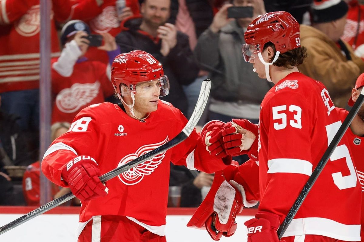 Jan 29, 2026; Detroit, Michigan, USA;  Detroit Red Wings right wing Patrick Kane (88) receives congratulations from teammates after he gets his 1375 point in the second period against the Washington Capitals at Little Caesars Arena. Mandatory Credit: Rick Osentoski-Imagn Images