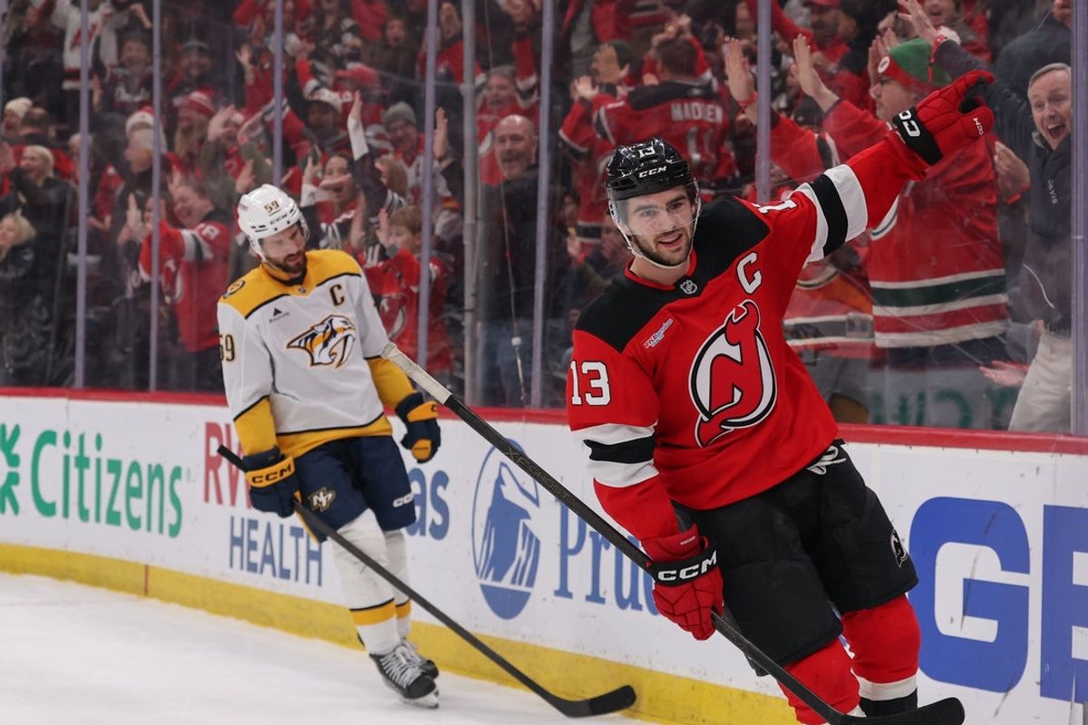 Jan 29, 2026; Newark, New Jersey, USA; New Jersey Devils center Nico Hischier (13) celebrates his overtime game winning goal against the Nashville Predators at Prudential Center. Mandatory Credit: Ed Mulholland-Imagn Images