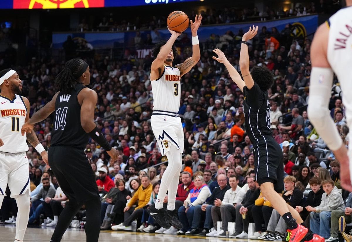 Jan 29, 2026; Denver, Colorado, USA; Denver Nuggets guard Julian Strawther (3) shoots over Brooklyn Nets guard Nolan Traore (88) in the second quarter at Ball Arena. Mandatory Credit: Ron Chenoy-Imagn Images