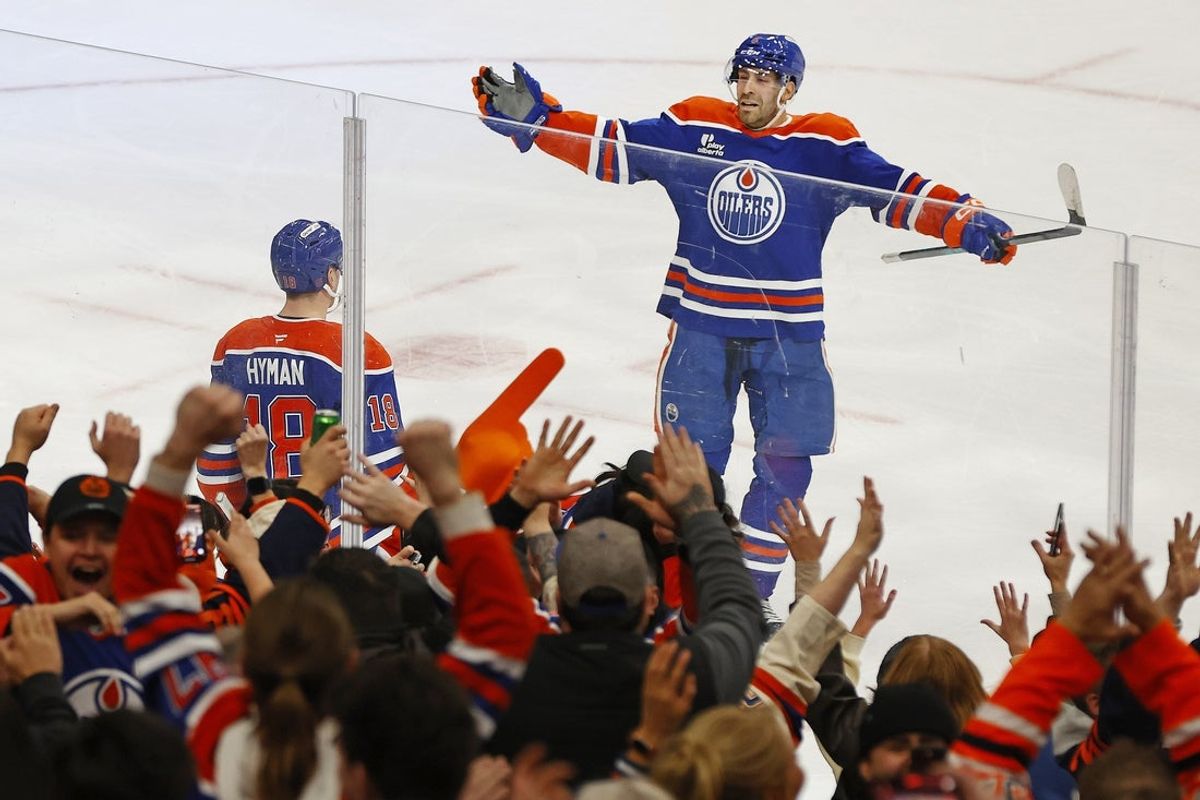 Jan 29, 2026; Edmonton, Alberta, CAN; Edmonton Oilers forward Zach Hyman (18) and defensemen Evan Bouchard (2) celebrate after scoring a goal during overtime against the San Jose Sharks at Rogers Place. Mandatory Credit: Perry Nelson-Imagn Images