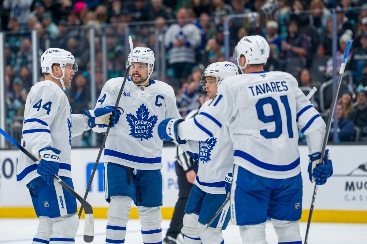 Jan 29, 2026; Seattle, Washington, USA; Toronto Maple Leafs, from left, defenseman Morgan Rielly (44), forward Auston Matthews (34), forward Max Domi (11) and forward John Tavares (91) celebrate a goal during the third period at Climate Pledge Arena. Mandatory Credit: Stephen Brashear-Imagn Images