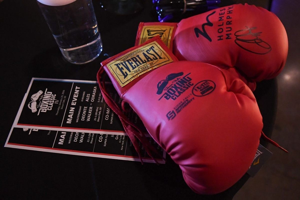 A pair of boxing gloves sit on one of the tables during the Sioux Falls Boxing Classic IV on Thursday, Jan. 29, 2026, at The District in Sioux Falls, South Dakota.