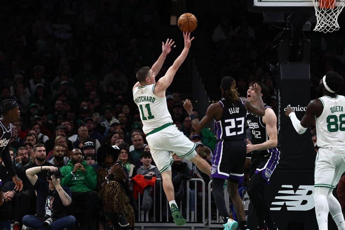 Jan 30, 2026; Boston, Massachusetts, USA; Boston Celtics guard Payton Pritchard (11) shoots against the Sacramento Kings during the second quarter at TD Garden. Mandatory Credit: Winslow Townson-Imagn Images