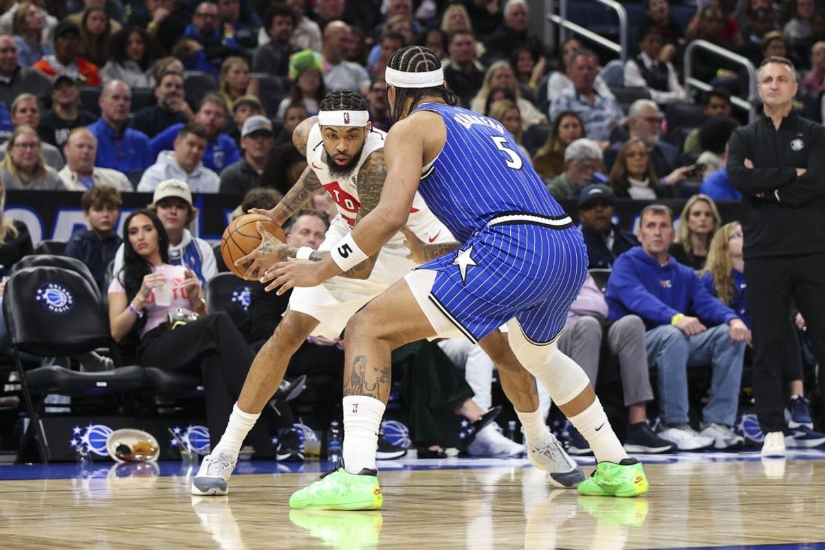 Jan 30, 2026; Orlando, Florida, USA; Toronto Raptors forward Brandon Ingram (3) is guarded by Orlando Magic forward Paolo Banchero (5) in the third quarter at Kia Center. Mandatory Credit: Nathan Ray Seebeck-Imagn Images