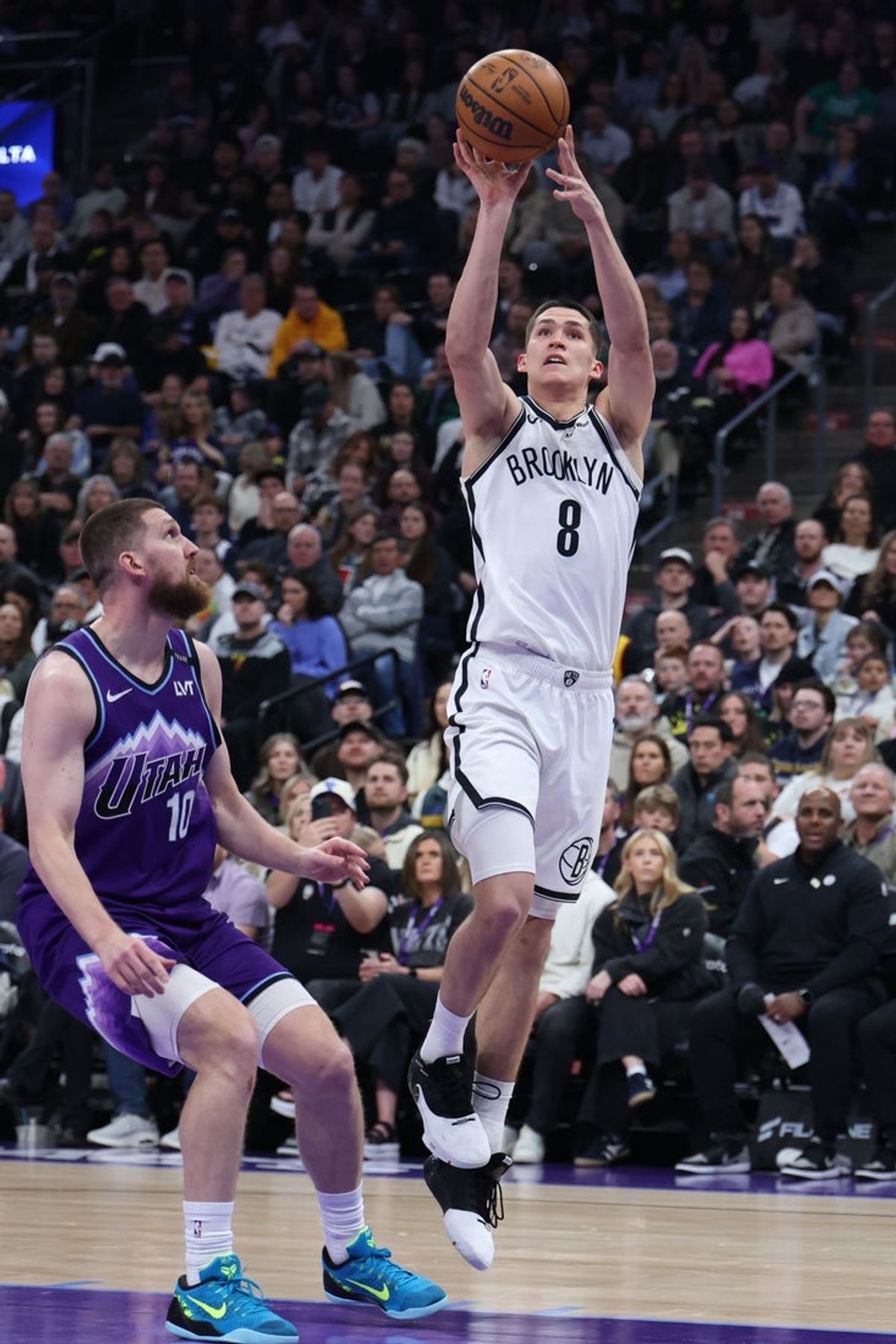 Jan 30, 2026; Salt Lake City, Utah, USA; Brooklyn Nets guard Egor Demin (8) shoots over Utah Jazz guard Svi Mykhailiuk (10) during the first half at Delta Center. Mandatory Credit: Rob Gray-Imagn Images