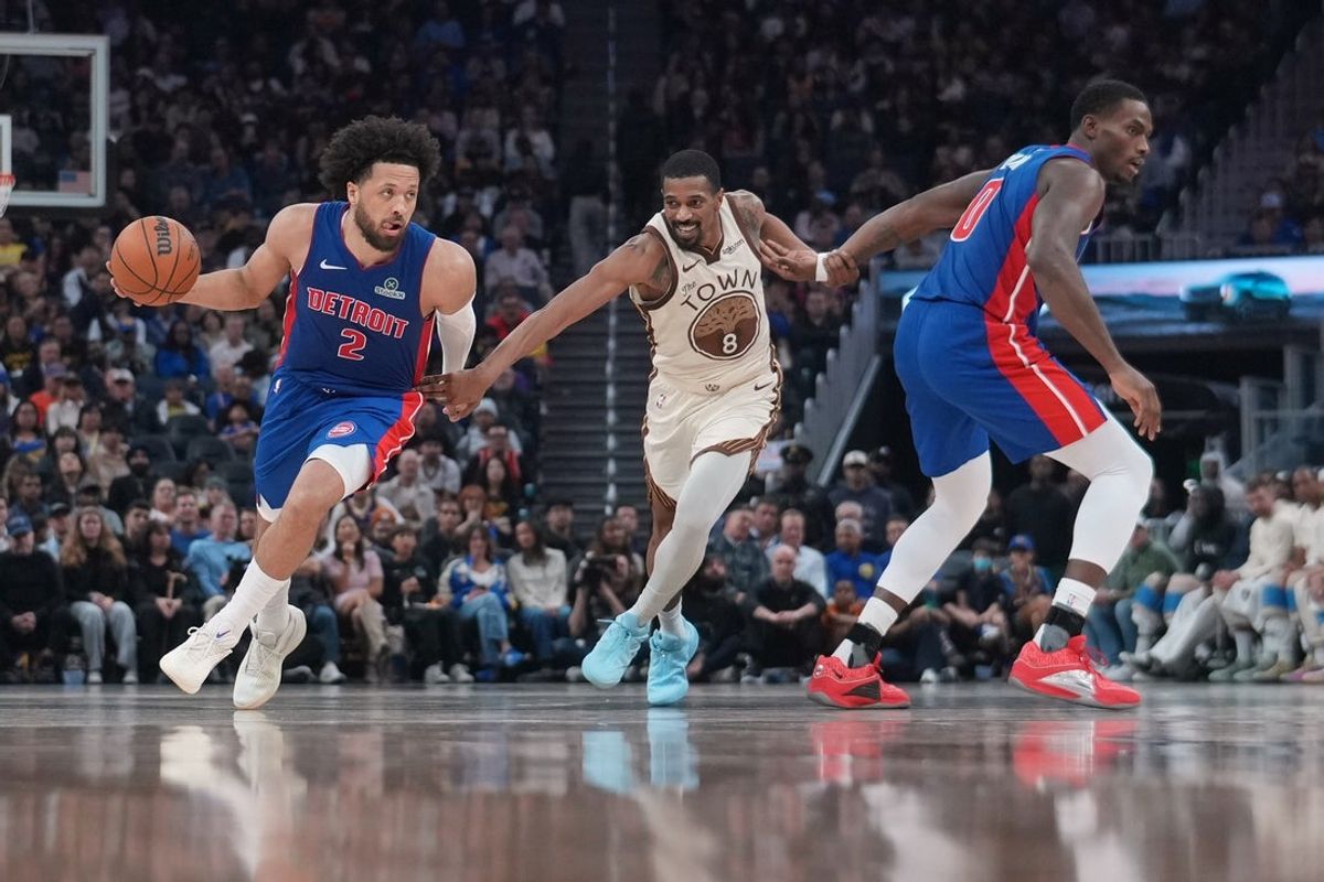 Jan 30, 2026; San Francisco, California, USA; Detroit Pistons guard Cade Cunningham (2) dribbles past Golden State Warriors guard De'Anthony Melton (8) in the second quarter at the Chase Center. Mandatory Credit: Cary Edmondson-Imagn Images
