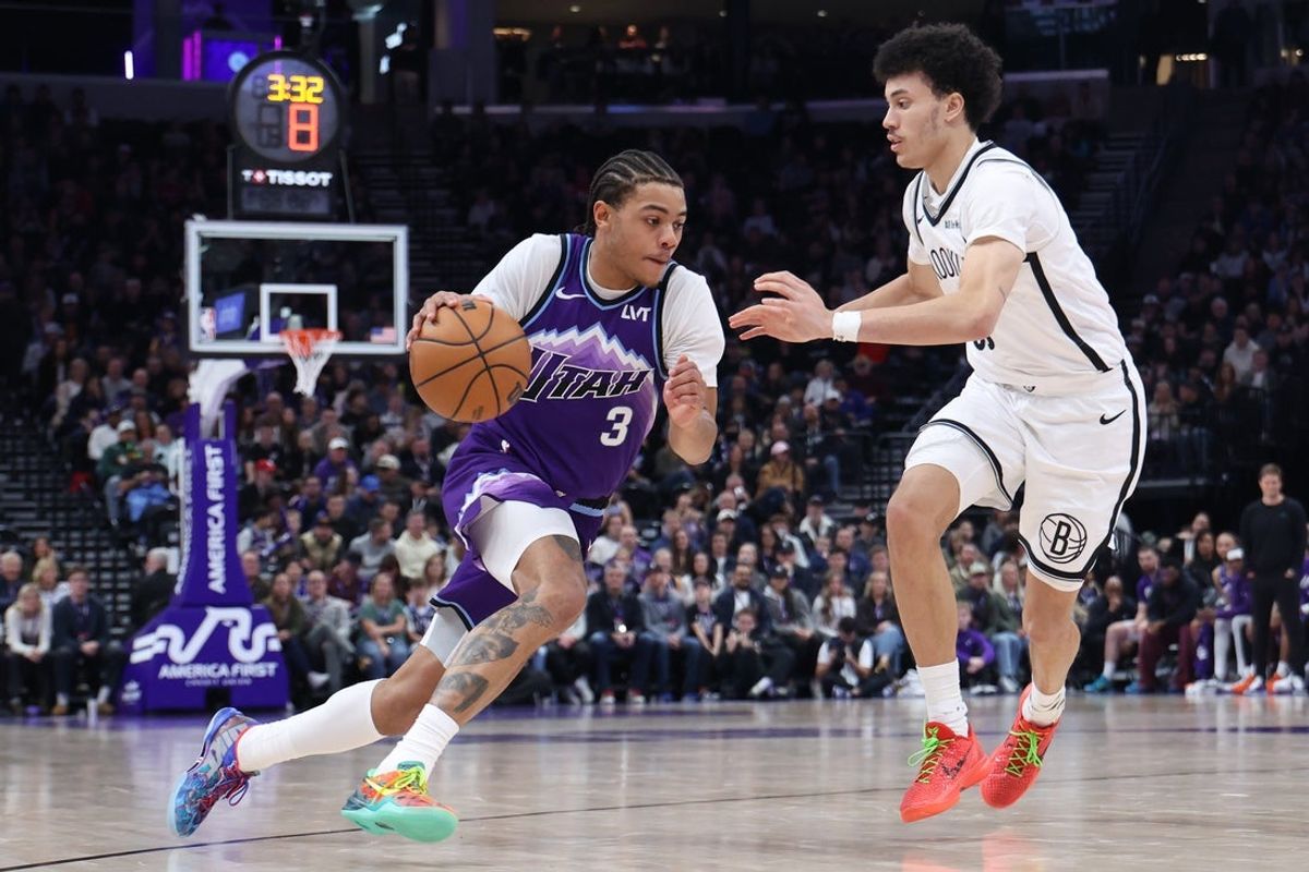 Jan 30, 2026; Salt Lake City, Utah, USA; Utah Jazz guard Keyonte George (3) drives against Brooklyn Nets guard Nolan Traore (88) during the second half at Delta Center. Mandatory Credit: Rob Gray-Imagn Images