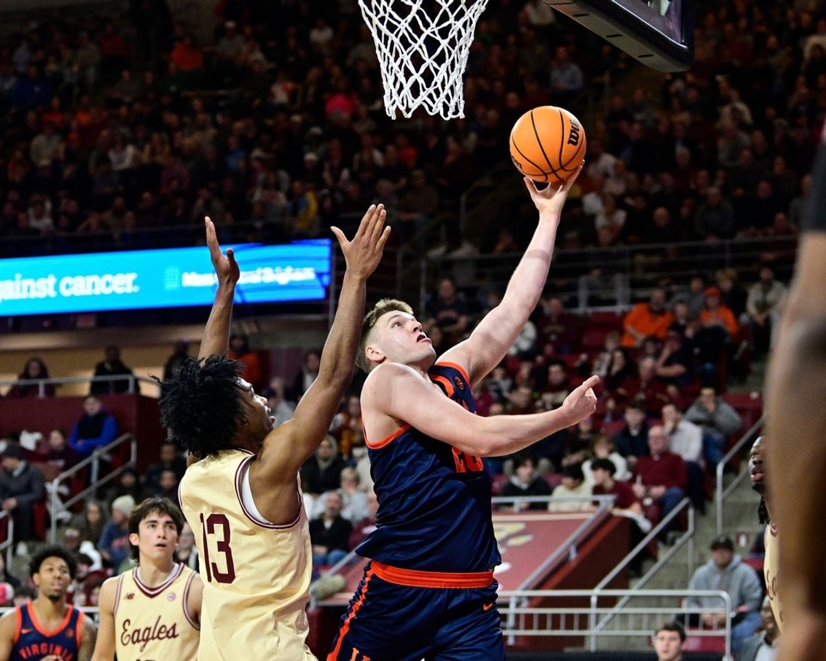 Jan 31, 2026; Chestnut Hill, Massachusetts, USA; Virginia Cavaliers forward Thijs de Ridder (28) shoots a lay up against Boston College Eagles guard Donald Hand Jr. (13) during the first half at Conte Forum. Mandatory Credit: Eric Canha-Imagn Images