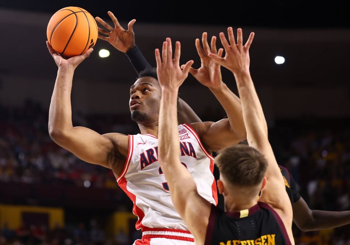 Jan 31, 2026; Tempe, Arizona, USA; Arizona Wildcats forward Tobe Awaka (30) drives to the basket against the Arizona State Sun Devils in the first half at Desert Financial Arena. Mandatory Credit: Mark J. Rebilas-Imagn Images