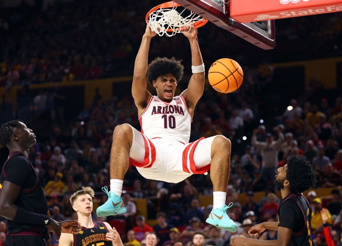 Jan 31, 2026; Tempe, Arizona, USA; Arizona Wildcats forward Koa Peat (10) screams as he slam dunks the ball against the Arizona State Sun Devils in the second half at Desert Financial Arena. Mandatory Credit: Mark J. Rebilas-Imagn Images