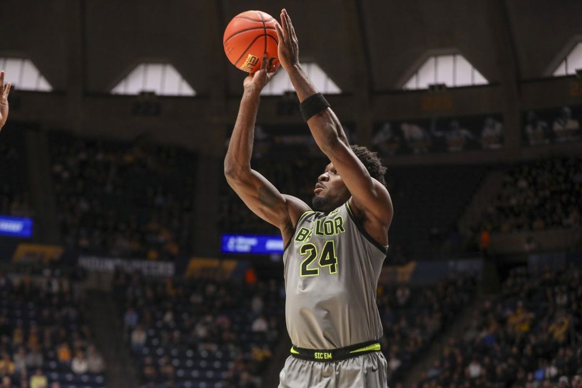 Jan 31, 2026; Morgantown, West Virginia, USA; Baylor Bears guard Tounde Yessoufou (24) shoots a three pointer during the first half against the West Virginia Mountaineers at Hope Coliseum. Mandatory Credit: Ben Queen-Imagn Images