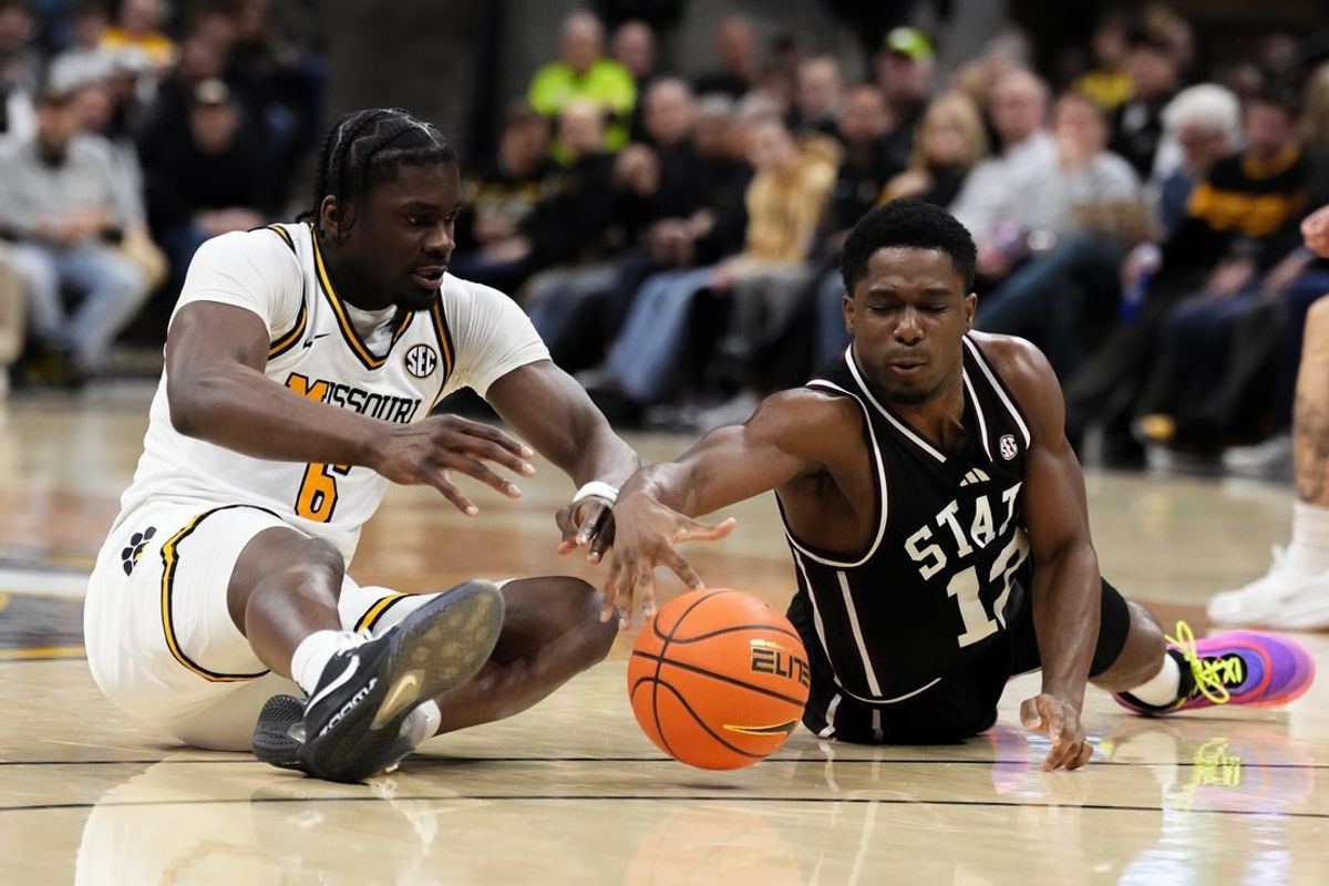 Jan 31, 2026; Columbia, Missouri, USA; Missouri Tigers guard Annor Boateng (6) and Mississippi State Bulldogs guard Josh Hubbard (12) scramble for a loose ball during the first half of the game at Mizzou Arena. Mandatory Credit: Denny Medley-Imagn Images