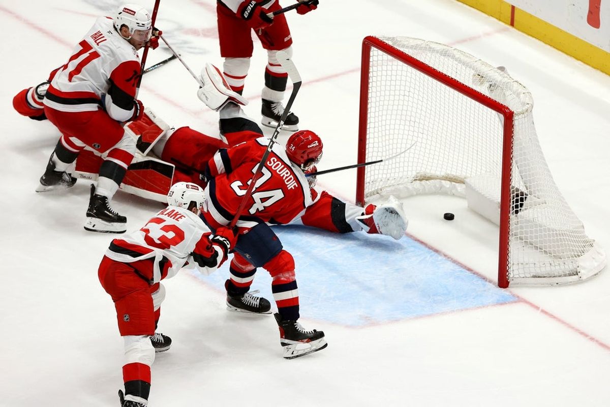 Jan 31, 2026; Washington, District of Columbia, USA; Washington Capitals right wing Justin Sourdif (34) scores the game-winning goal during overtime against the Carolina Hurricanes at Capital One Arena. Mandatory Credit: Daniel Kucin Jr.-Imagn Images