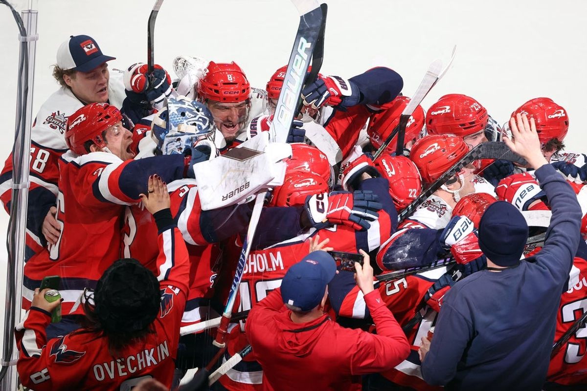 Jan 31, 2026; Washington, District of Columbia, USA; Washington Capitals players celebrate in overtime against the Carolina Hurricanes at Capital One Arena. Mandatory Credit: Daniel Kucin Jr.-Imagn Images