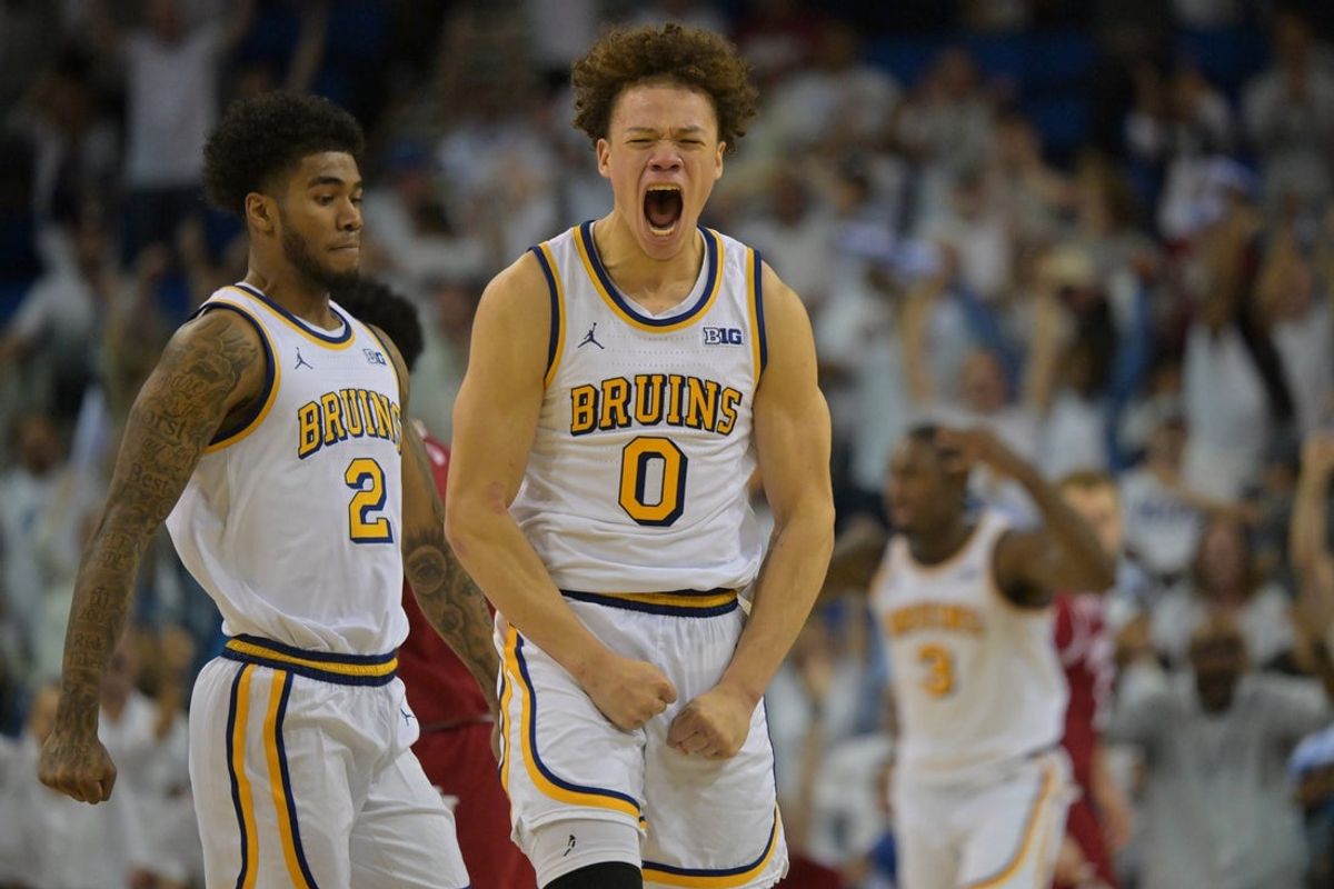 Jan 31, 2026; Los Angeles, California, USA;  UCLA Bruins guard Trent Perry (0) reacts after a three-point basket to tie the game with one second in regulation time against the Indiana Hoosiers at Pauley Pavilion presented by Wescom Financial. Mandatory Credit: Jayne Kamin-Oncea-Imagn Images