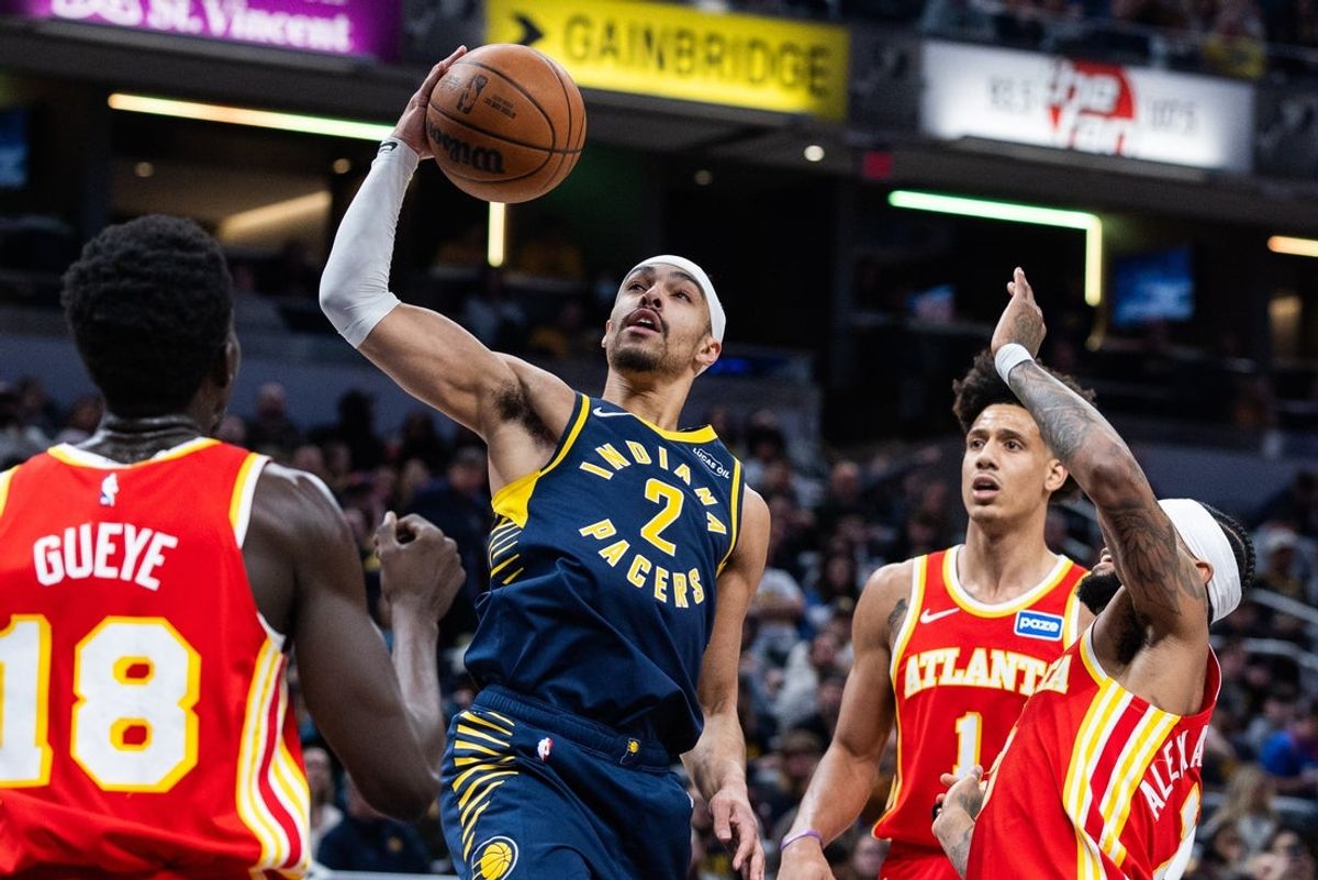 Jan 31, 2026; Indianapolis, Indiana, USA; Indiana Pacers guard/forward Andrew Nembhard (2) shoots the ball while Atlanta Hawks guard Nickeil Alexander-Walker (7) defends in the first half at Gainbridge Fieldhouse. Mandatory Credit: Trevor Ruszkowski-Imagn Images