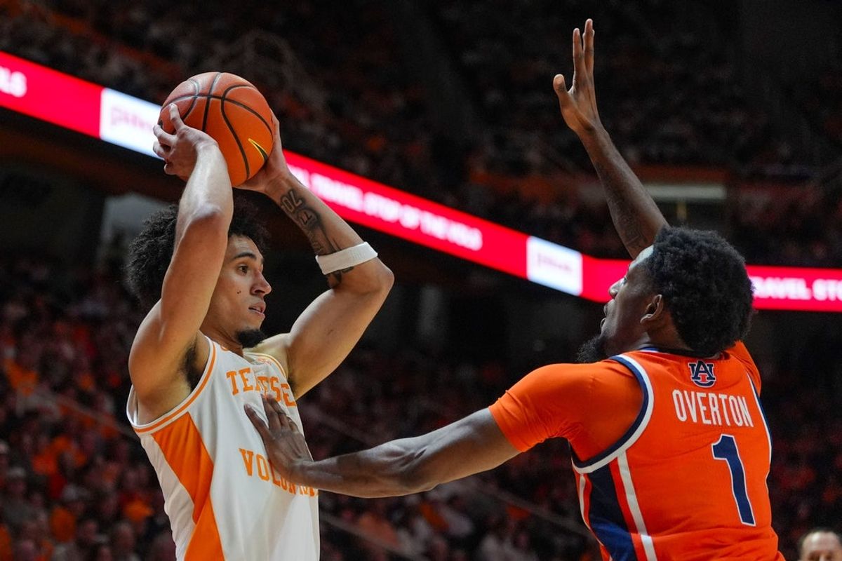 Auburn's Kevin Overton (1) rests is hand on Tennessee guard Bishop Boswell (3) during a NCAA basketball game between the Tennessee Volunteers and Auburn Tigers at Thompson-Boling Arena at Food City Center in Knoxville, Tenn., on Jan. 31, 2026.