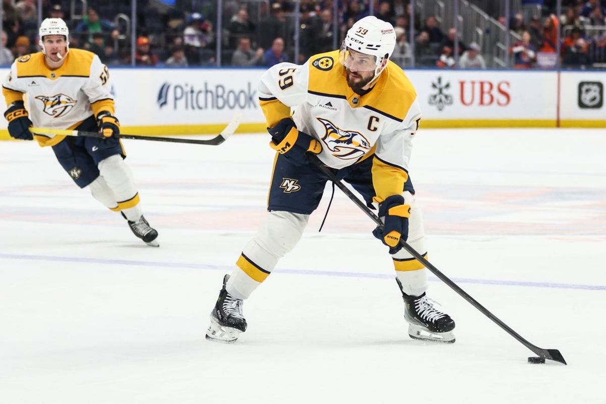 Jan 31, 2026; Elmont, New York, USA;  Nashville Predators defenseman Roman Josi (59) attempts a shot on goal in the third period against the New York Islanders at UBS Arena. Mandatory Credit: Wendell Cruz-Imagn Images