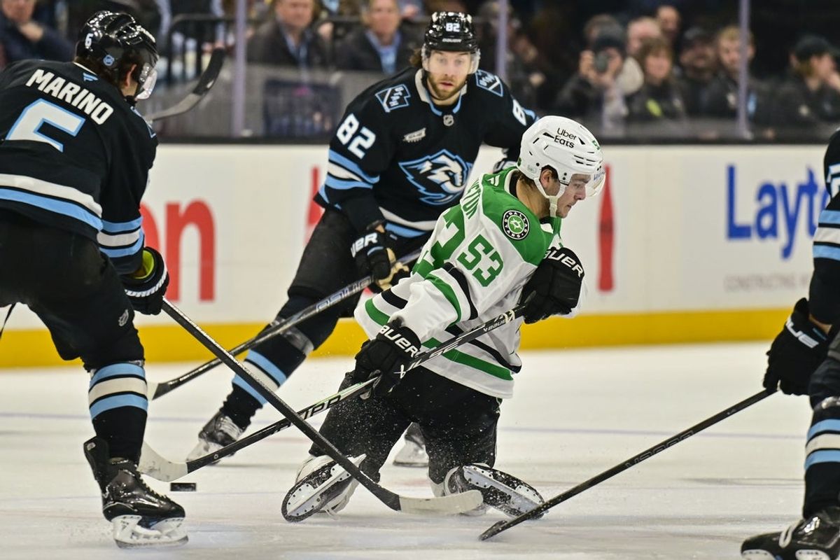 Jan 31, 2026; Salt Lake City, Utah, USA; Dallas Stars center Wyatt Johnston (53) makes a pass behind the back during first period around Utah Mammoth defenseman John Marino (6) at Delta Center. Mandatory Credit: Peter Creveling-Imagn Images