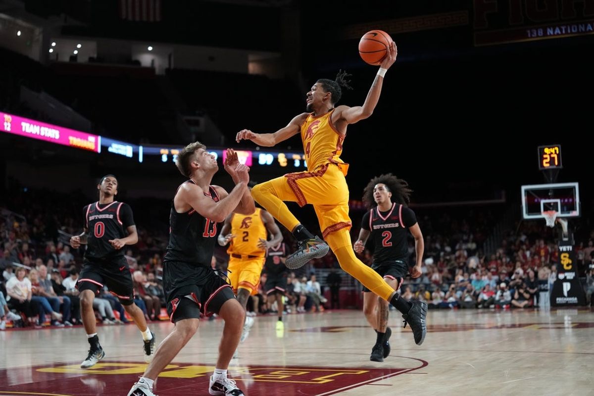 Jan 31, 2026; Los Angeles, California, USA; Southern California Trojans guard Chad Baker-Mazara (4) shoots the ball against Rutgers Scarlet Knights guard Harun Zrno (13) in the second half at Galen Center. Mandatory Credit: Kirby Lee-Imagn Images