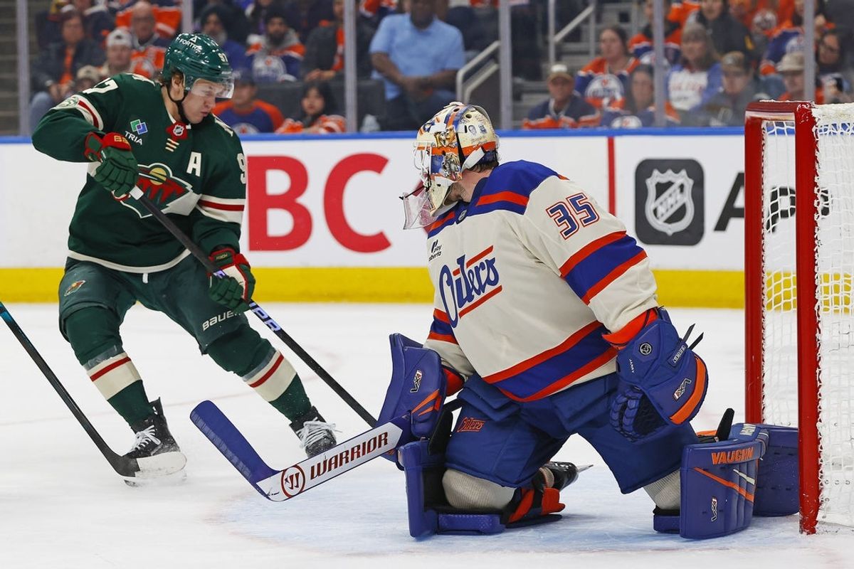 Jan 31, 2026; Edmonton, Alberta, CAN; Minnesota Wild forward Kirill Kaprizov (97) tries to get to a loose puck behind Edmonton Oilers goaltender Tristan Jarry (35) during the second period at Rogers Place. Mandatory Credit: Perry Nelson-Imagn Images