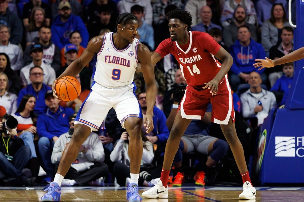 Feb 1, 2026; Gainesville, Florida, USA; Florida Gators center Rueben Chinyelu (9) posts up against Alabama Crimson Tide center Charles Bediako (14) during the first half at Exactech Arena at the Stephen C. O'Connell Center. Mandatory Credit: Matt Pendleton-Imagn Images