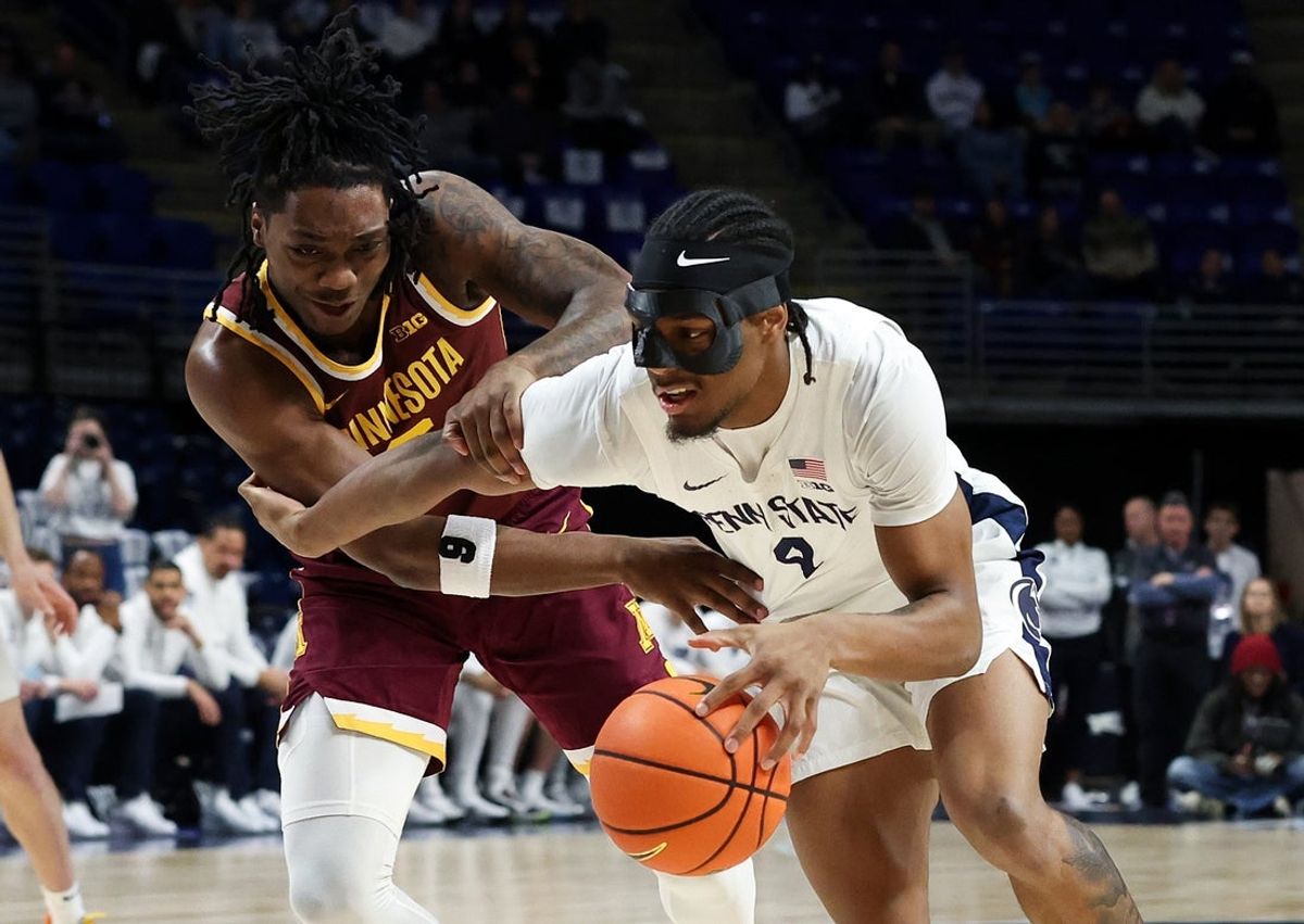 Feb 1, 2026; University Park, Pennsylvania, USA; Penn State Nittany Lions guard Kayden Mingo (4) dribbles the ball as Minnesota Golden Gophers guard Langston Reynolds (6) defends during the first half at Bryce Jordan Center. Mandatory Credit: Matthew O'Haren-Imagn Images