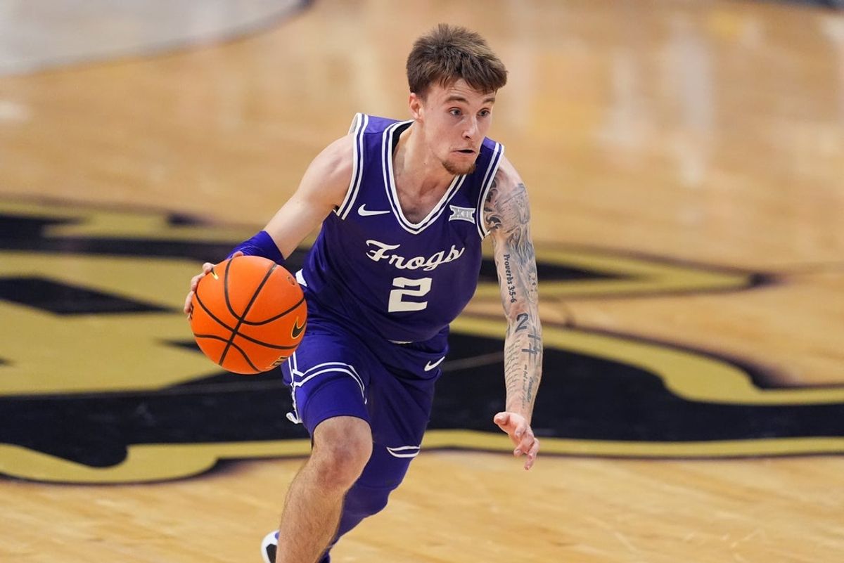 Feb 1, 2026; Boulder, Colorado, USA; Texas Christian University Horned Frogs guard Brock Harding (2) controls the ball in the first half against the Colorado Buffaloes at the CU Events Center. Mandatory Credit: Ron Chenoy-Imagn Images